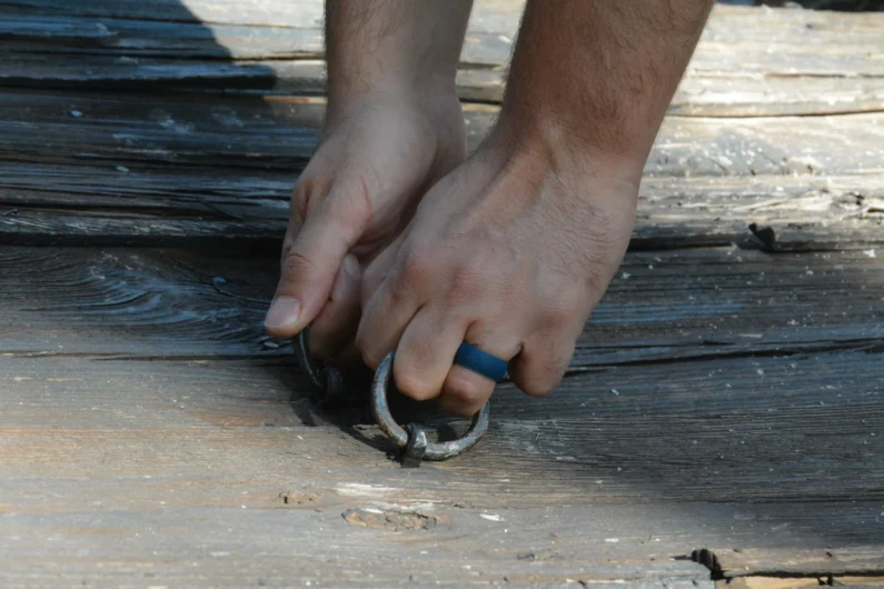 Man wearing the Adventure Blue Silicone Ring during outdoor activities, highlighting comfort and style for active lifestyles